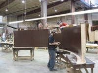 Thumb shop workers with curved island back