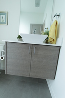 Thumb vanity  contemporary style  custom laminate  banded door  floating  frameless construction  single vessel sink