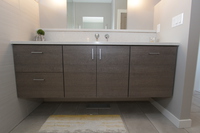 Thumb vanity  contemporary style  custom laminate  grey color  banded door  floating  frameless construction  3 