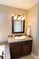 Thumb vanity  shaker style  knotty alder  dark color   recessed panel  single sink  standard overlay