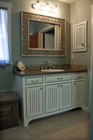Thumb vanity  traditional style  painted with glaze  wainscot panel  flush mount  bevel drawer fronts  medicine cabinet  arched toekick  accent color bench seat