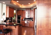 Thumb kitchen  contemporary style  cherry  medium color  recessed panel doors and drawer fronts  recessed panel ends  frosted glass doors  square crown molding