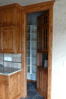Thumb kitchen  traditional style  knotty alder  medium color  raised panel  flush mount  hidden room door   13 crown