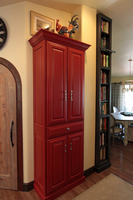 Thumb kitchen  traditional style  painted  raised panel  sand through  red  bookcase accent color dark stain  standard overlay