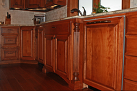 Thumb kitchen  traditional style  western maple  cherry color  raised panel  dishwasher front panel  legs  posts  feet