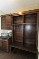 Thumb misc  contemporary style  quartersawn walnut  dark color  banded door  cubbies  lockers  coat hooks  drop off station  bench  full overlay